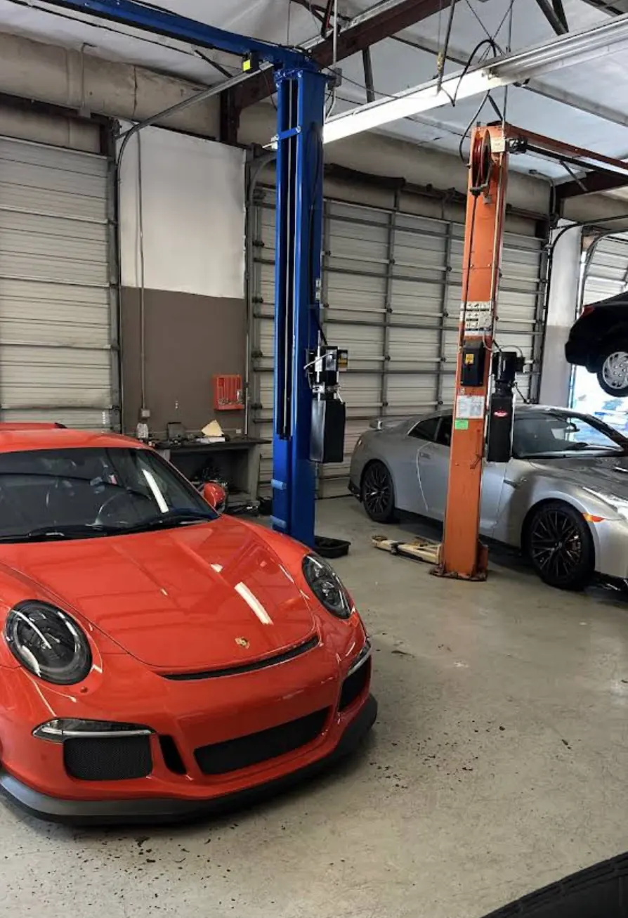 Porsche in an American Auto service bay near Sugar Land, TX