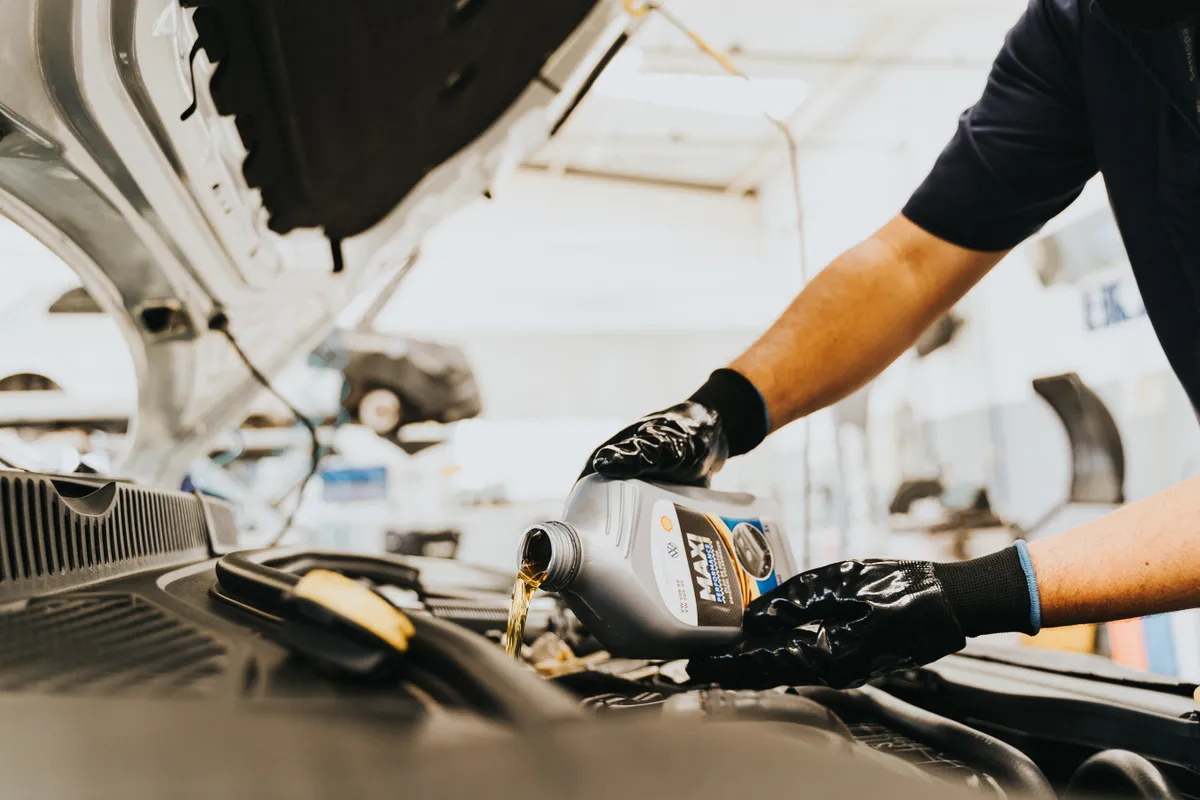 Oil change service with fresh engine oil for Sugar Land vehicles